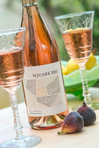 Square Peg Rosé bottle and wine glasses